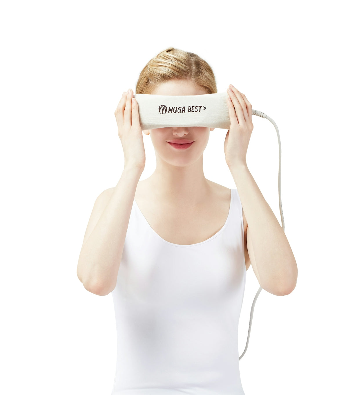 a woman holding a white object over her eyes